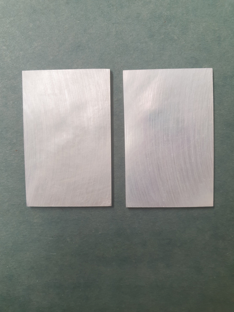 <p>White Mother of Pearl flat no figure, clear face size 35mm (1.38") width x 55mm (2.16") length x 2mm (0.078") thickness A grade good on both sides.</p>