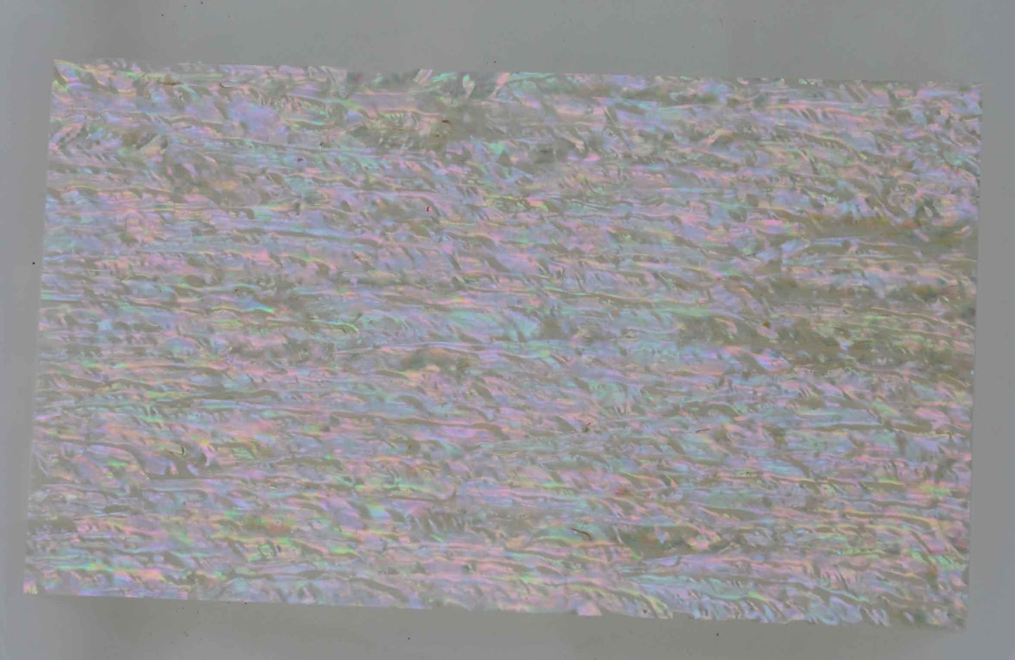 Awabi R laminated shell sheets are made from genuine shell. Each sheet has shell throughout consisting of layers of smaller shell pcs. Sheet size 235 x 135mm (9.25 x 5.3"). Thickness 3mm (0.12") Ideal for inlay work, jewellery, knife handles. Economical and easy to cut. All layers are A grade same consistency throughout the sheet.