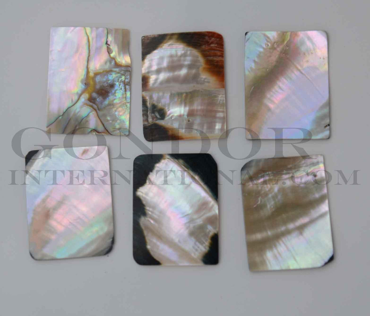 Black abalone rectangle 30mm (1.18") width x 40mm (1.58") length x 2mm (0.08") thickness. Polished pcs with flat back and natural shell curve. Now extremely rare especially in this size. Mainly used for jewellery but some pcs are also suitable for inlay or other decorative purposes.