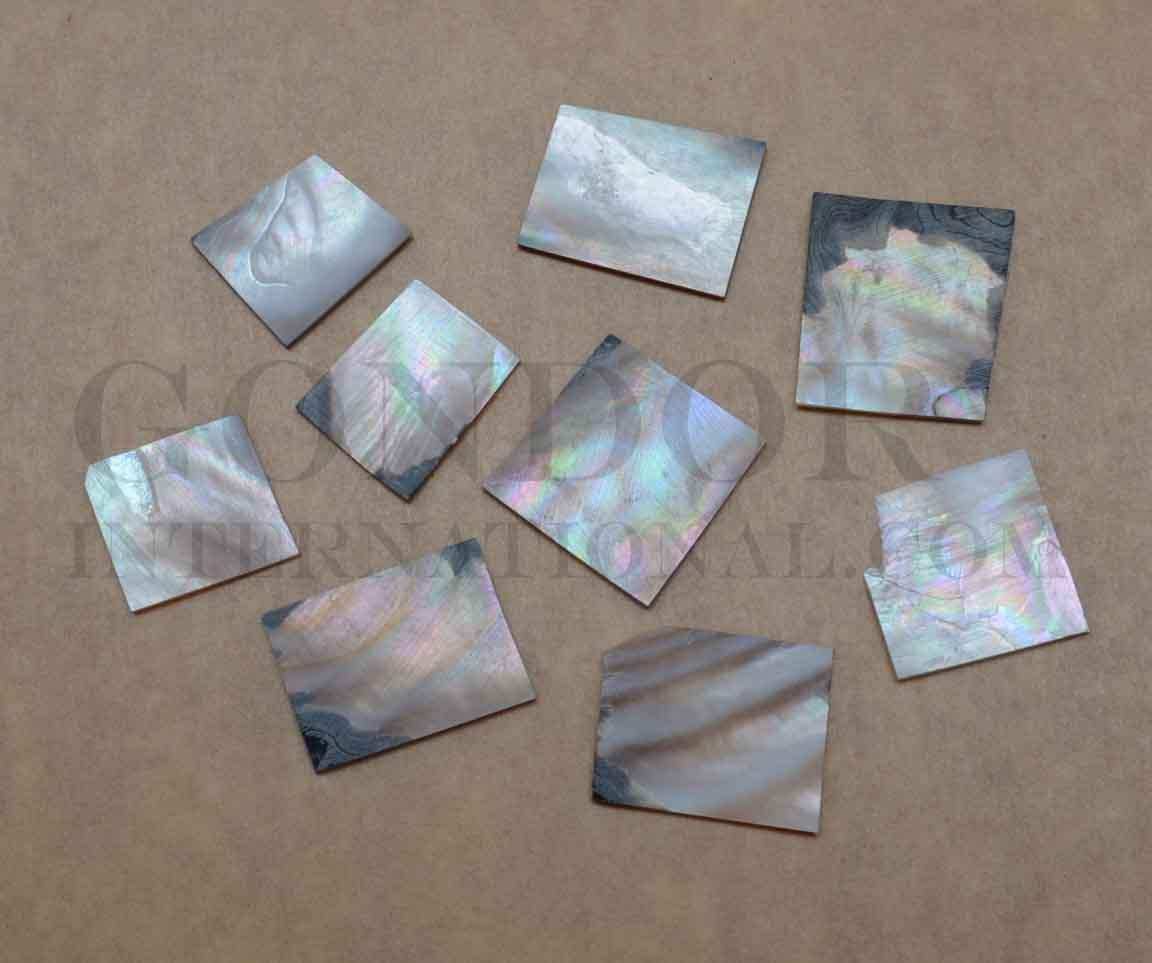 Brownlip Mother of Pearl flat inlay blanks mix size 1.3mm (0.05") thickness irregular shape A grade. Sold by oz - approx. 7 - 10pcs per oz size approx. 15-25mm x 20-30mm