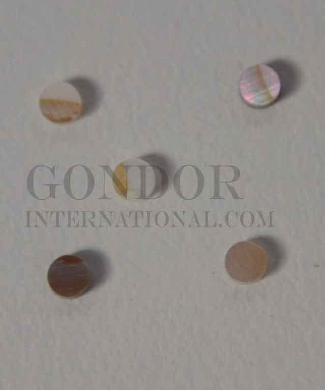 Brown mussel shell dots 2.5mm diameter 1.3mm thickness are round flat shell pcs cut to precise diameter and thickness. Ideal for use in inlay applications - for fretboard markers and general inlay or jewellery decorations. All pcs are A grade.<br /> 