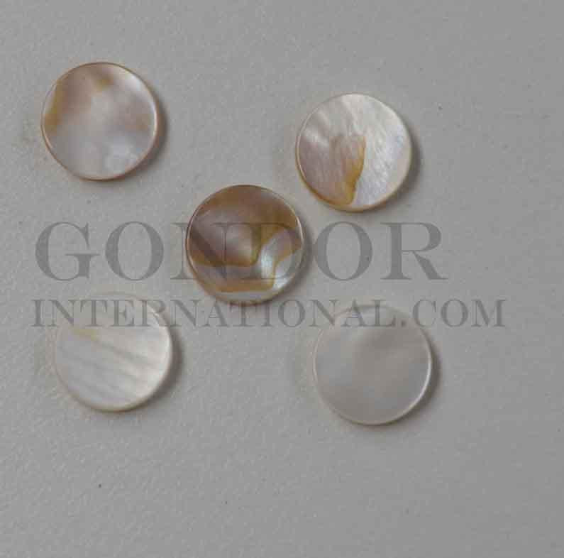 Brown mussel shell dots 9mm diameter 1.3mm thickness are round flat shell pcs cut to precise diameter and thickness. Ideal for use in inlay applications - for fretboard markers and general inlay or jewellery decorations. All pcs are A grade.<br /> 