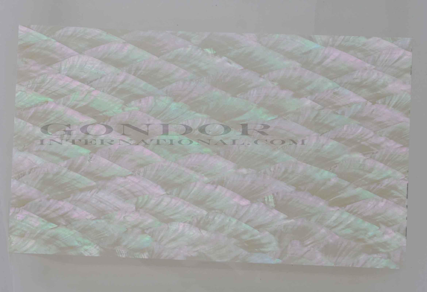 Donkey ear abalone laminated shell sheets are made from genuine shell. Each sheet has shell throughout consisting of layers of smaller shell pcs. Sheet size 235 x 135mm (9.25 x 5.3"). Thickness 3mm (0.118") Ideal for inlay work, marquetry, jewellery, knife handles. Economical and easy to cut. All layers are A grade same consistency throughout the sheet.