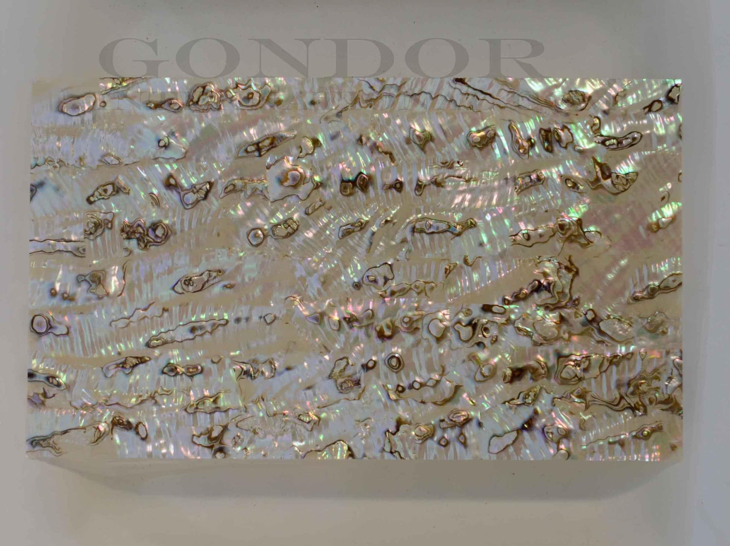 Green abalone shell veneer light also called Mexican green abalone sheet or Green abalone shell paper. Made from thin slices of genuine shell. Sheet size 240 x 140mm average thickness 0.15mm. Suitable for signwriting, marquetry, fishing lures, jewellery, architectural application, furniture and many other applications. Available with options - self adhesive backing, colour coating 1 side and a combination of colour coating and self adhesive.