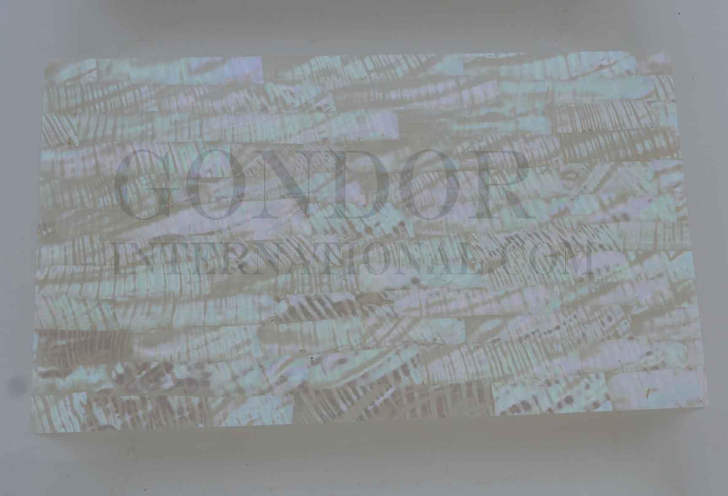 Green abalone shell veneer rippled also called Mexican green abalone sheet or Green abalone shell paper. Made from thin slices of genuine shell. Sheet size 240 x 140mm average thickness 0.15mm. Suitable for signwriting, marquetry, fishing lures, jewellery, architectural application, furniture and many other applications. Available with options - self adhesive backing, colour coating 1 side and a combination of colour coating and self adhesive.