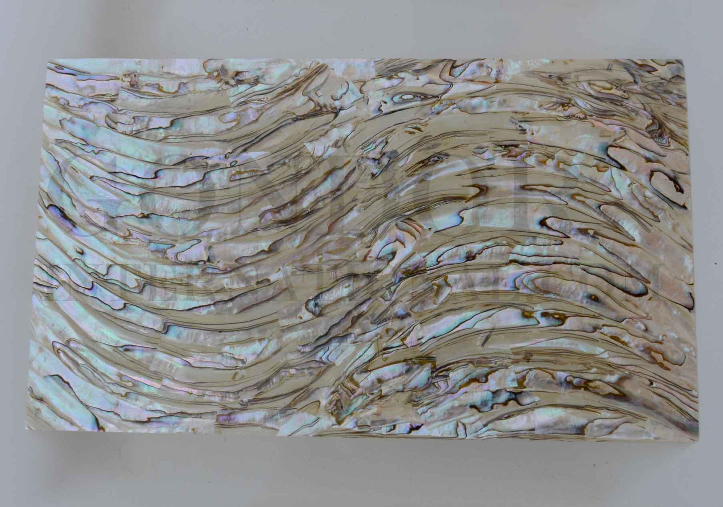 Green abalone shell veneer rim also called Mexican green abalone sheet or Green abalone shell paper. Made from thin slices of genuine shell. Sheet size 240 x 140mm average thickness 0.3mm. Suitable for signwriting, marquetry, fishing lures, jewellery, architectural application, furniture and many other applications. Available with options - self adhesive backing, colour coating 1 side and a combination of colour coating and self adhesive.
