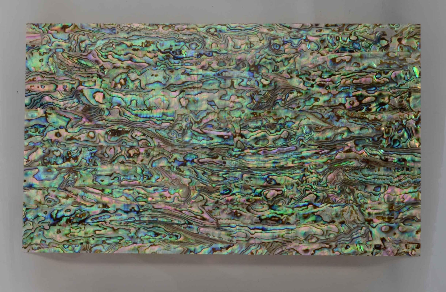 Paua A veneer also called Paua A sheet or Paua A shell paper. Made from thin slices of genuine shell. Sheet size 140mm (5.51") width x 240mm (9.45") length x 0.3mm (0.012") thickness Suitable for signwriting, fishing lures, jewellery, architectural application, furniture and many other applications.