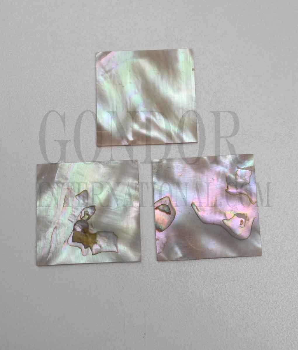 Red abalone flat blanks size 50mm (2") width x 50mm (2") length x 1.5mm (0.06") thickness. Suitable for knife handles as well as inlay and jewellery applications. Good on at least 1 side.