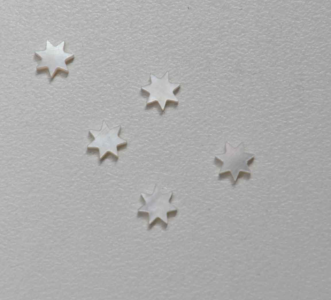 White Mother of Pearl 7 point star size 7mm (0.275") x 1.5mm (0.06") thickness. Some uses include fretboard markers, musical instrument inlay, furniture inlay and other general decorative inlay and jewellery applications. All pcs are A grade.