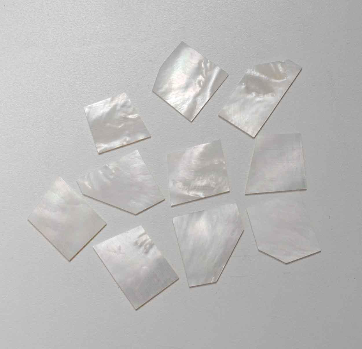 <p>White Mother of Pearl flat inlay blanks mix size 15 - 30mm (0.59 - 1.18") width x 20 - 40mm (0.79 - 1.57") length x 1.5mm (0.06") thickness. B grade, has cracks on some parts of blanks not on all parts. </p>