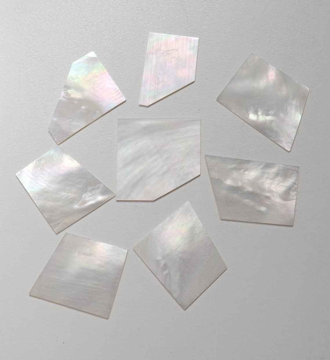 <p>White Mother of Pearl flat inlay blanks medium size 25 - 40mm (1 - 1.57") width x 30 - 50mm (1.18 - 2") length x 1.5mm (0.06") thickness A grade good on both sides.</p>