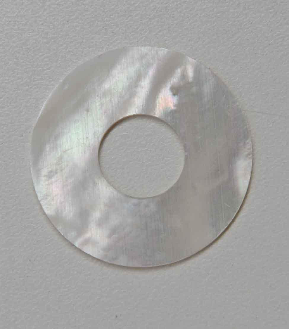 White Mother of Pearl discs with center hole 42mm (1.65") diameter x 1.3mm (0.05") thickness Center hole 16mm (0.63") - round flat shell pcs cut to precise diameter and thickness. Ideal for watch dials, inlay, jewellery decorations. All discs are A grade good on both sides.