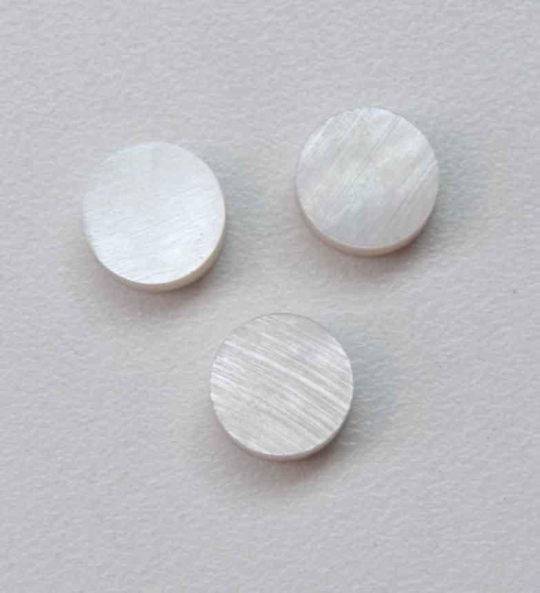 White Mother of Pearl dots 8.5mm diameter x 1.5mm thickness - round flat shell pcs cut to precise diameter and thickness. Ideal for use in inlay applications - for fretboard markers, bow frog eyes and general inlay or jewellery decorations. All dots are A grade good on both sides.