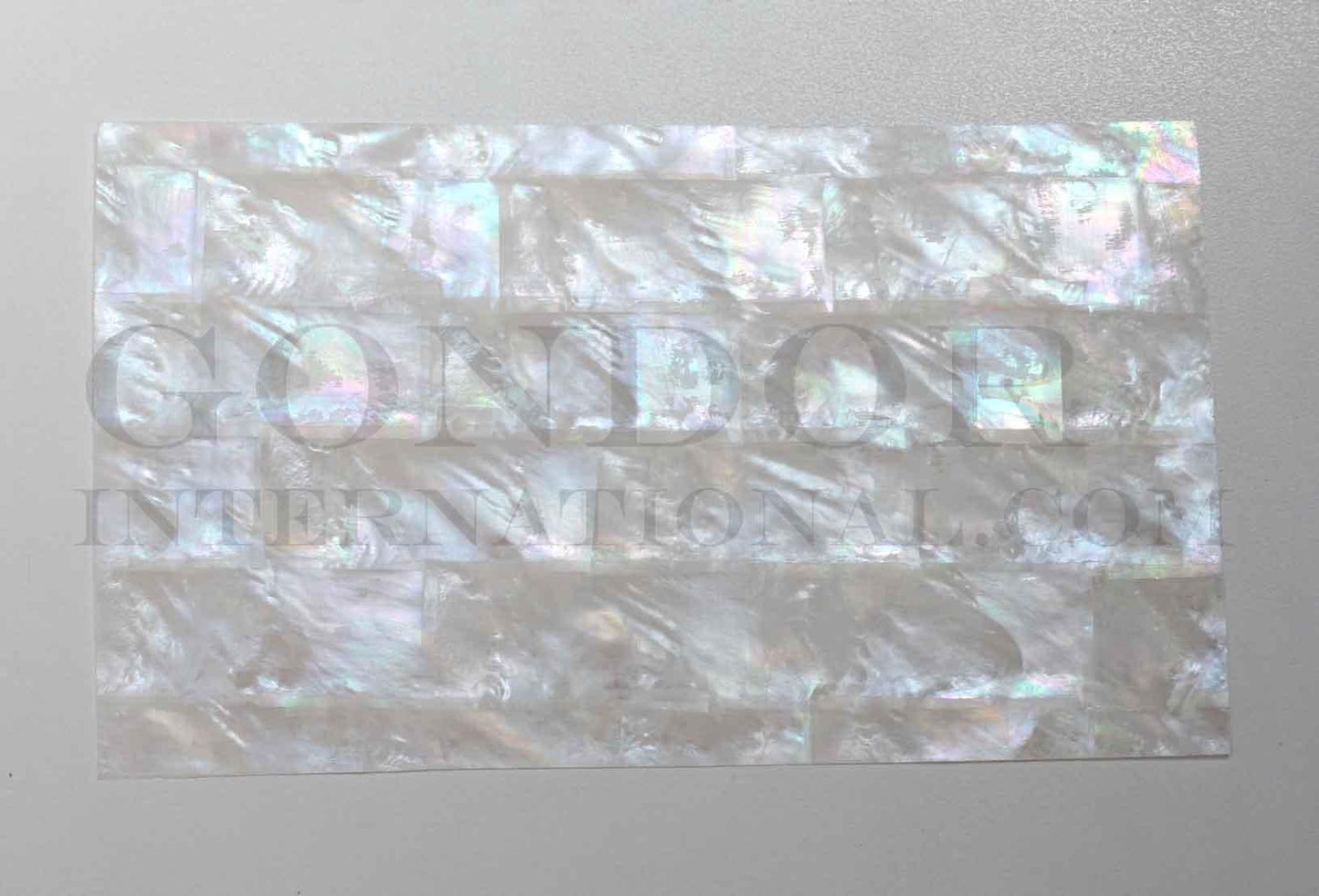 White MOP laminated sheets strip form. Made from genuine shell. Each sheet has shell throughout consisting of layers of smaller shell pcs. Sheet size 235 x 135mm (9.25 x 5.3"). Thickness 1mm (0.04") Ideal for inlay work, jewellery, knife handles. Economical and easy to cut. All layers are same consistency throughout the sheet.