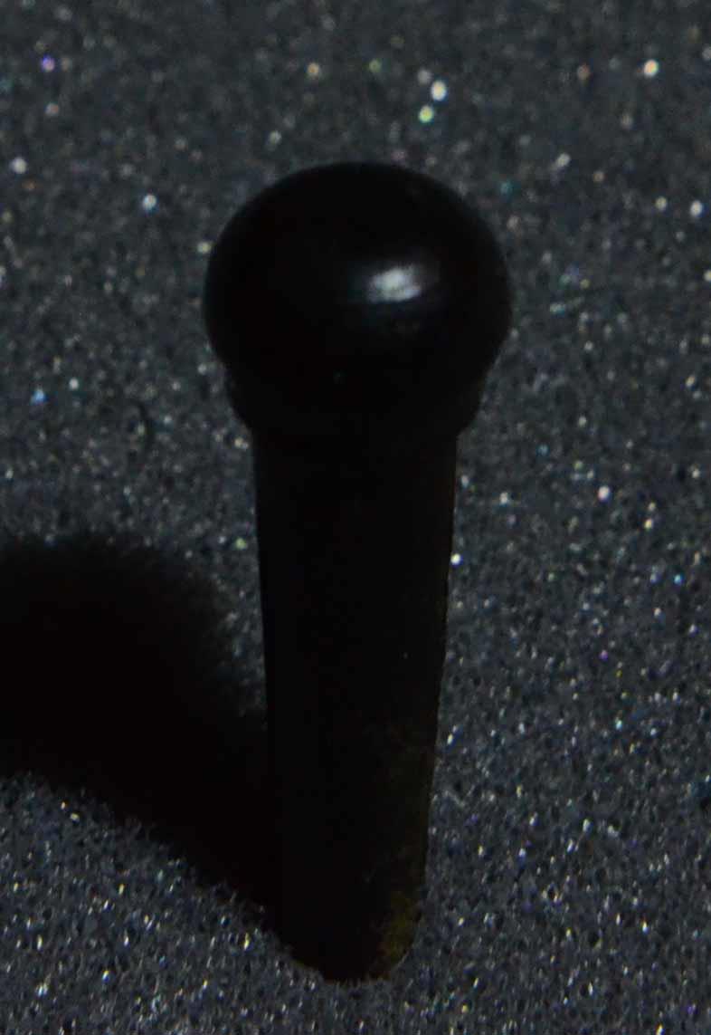 1 set (6pcs) Guitar bridge pins size 2A Ebony. Tapered shaft string slot running the full length of shaft. Diameter at top of shaft 5.6mm (0.22") length of shaft 25.5mm (1") . Will fit the following models - Martin guitars since 1994,as well as D-28 older Gibson guitars,and others.
