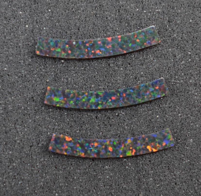 <p>Manufactured opal curved strips 3.17mm (0.125") width x 24mm (1") length x 1.3mm (0.05") thickness x 120mm (4.72") inside diameter suitable for musical instrument purfling - guitars, Ukuleles cut flat to specific dimensions.</p>