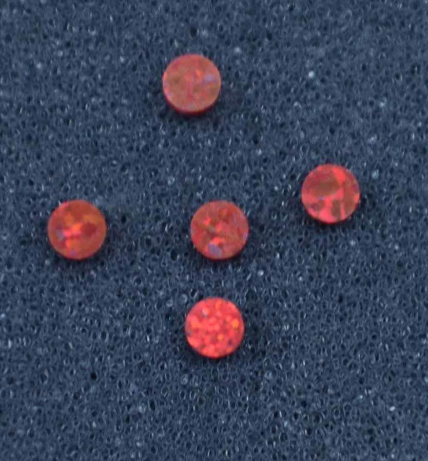 <p>Opal dots OP45 3 x 1.3mm flat pcs made to specific diameter and thickness made from manufactured opal suitable for inlay, fingerboard markers, jewellery, Opal dots can be worked same way as mother of pearl and are of similar hardness.</p>
