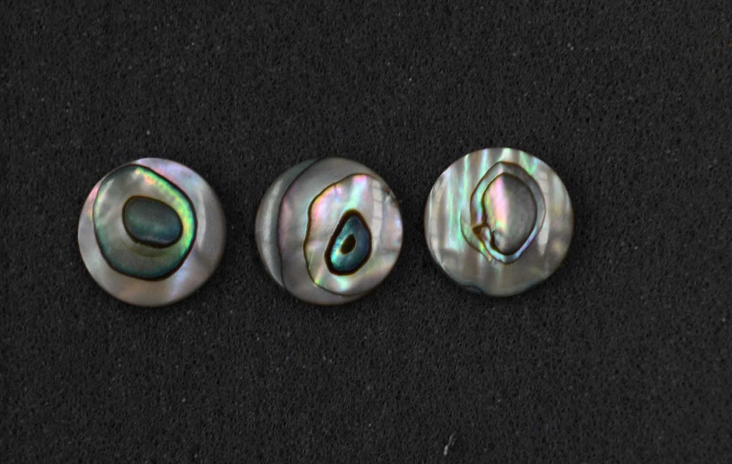<p>Green abalone domed finger button inlay 14.22mm (0.56") diameter 2.3mm (0.09") thickness domed and polished on 1 side round pcs Ideal for use in brasswind or woodwind instruments as well as accordions and general inlay or jewellery decorations. All pcs are A grade.</p>