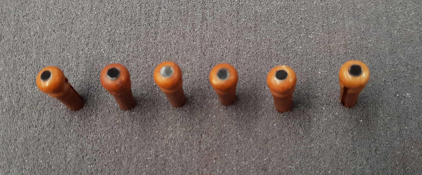 1 set (6pcs) Guitar bridge pins size 1 Rosewood with black mother of pearl dot. Tapered shaft string slot running the full length of shaft. Diameter at top of shaft 5.3mm (0.21") length of shaft 22.9mm (0.9") . Will fit the following models - Martin guitars prior to 1994 (except HD-28), Collings guitars, prior to 2002, Blanchard, Garrison, Goodall, Ryan, Santa Cruz, Taylor, Larrivee D-03R and others.
