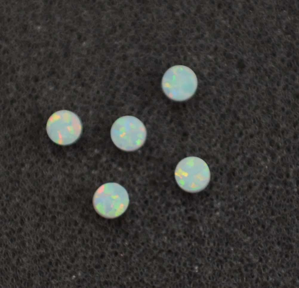 <p>Opal dots OP17 1.5 x 1.3mm flat pcs made to specific diameter and thickness made from manufactured opal suitable for inlay, fretboard markers, jewellery, Opal dots can be worked same way as mother of pearl and are of similar hardness.</p>