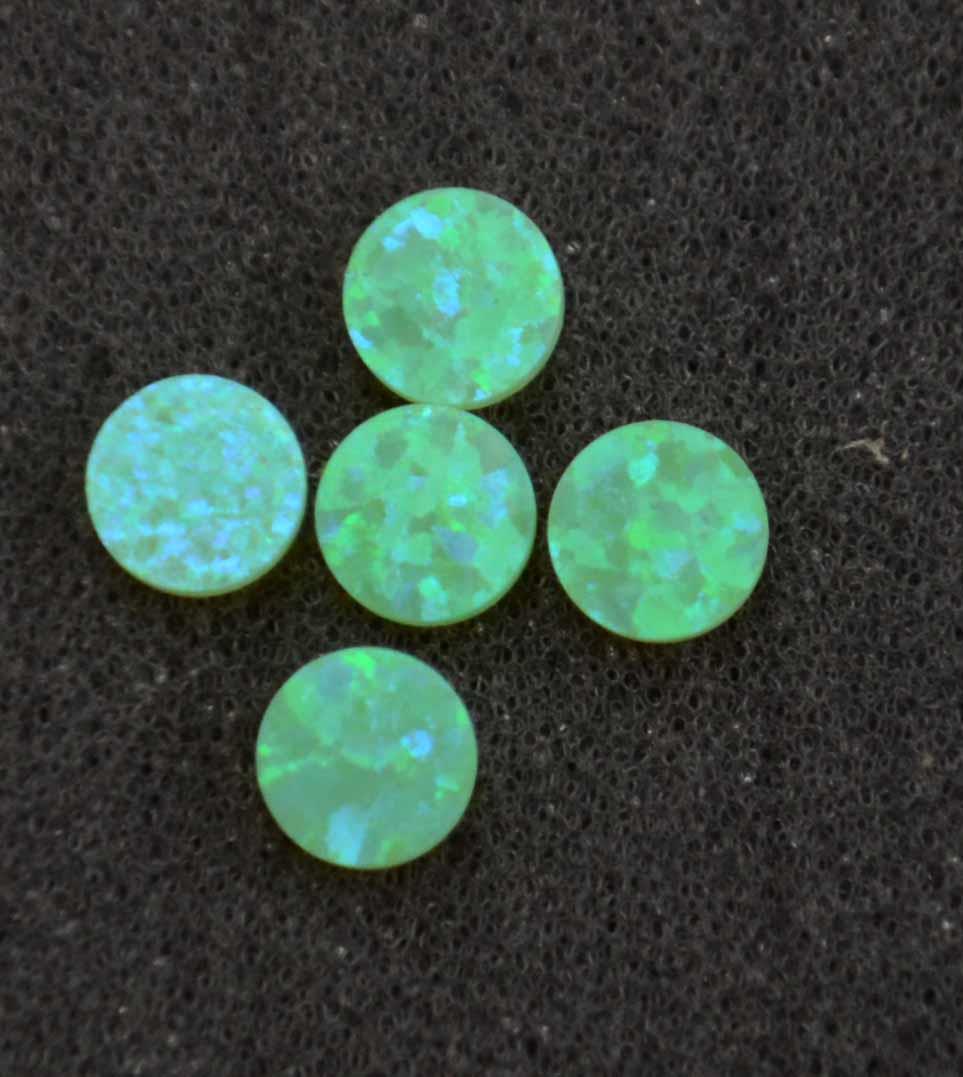<p>Opal dots OP56 9 x 1.3mm flat pcs made to specific diameter and thickness made from manufactured opal suitable for inlay, fingerboard markers, jewellery, Opal dots can be worked same way as mother of pearl and are of similar hardness.</p>