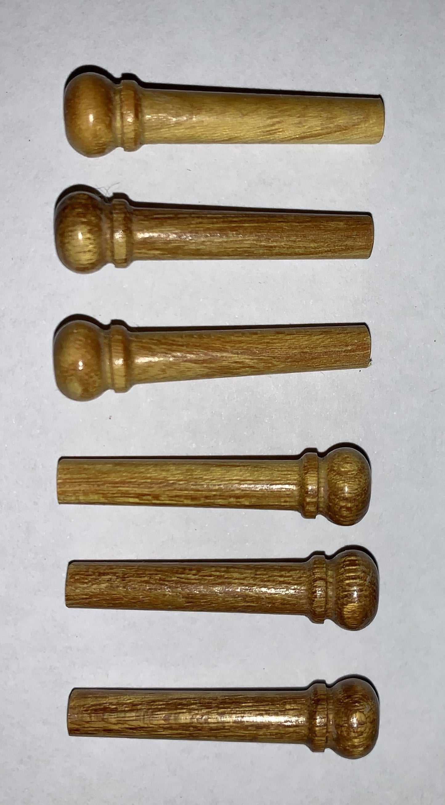1 set (6pcs) Guitar bridge pins size 1 Mulberry Tapered shaft string slot running the full length of shaft. Diameter at top of shaft 5.3mm (0.21") length of shaft 22.9mm (0.9") . Will fit the following models - Martin guitars prior to 1994 (except HD-28), Collings guitars, prior to 2002, Blanchard, Garrison, Goodall, Ryan, Santa Cruz, Taylor, Larrivee D-03R and others.