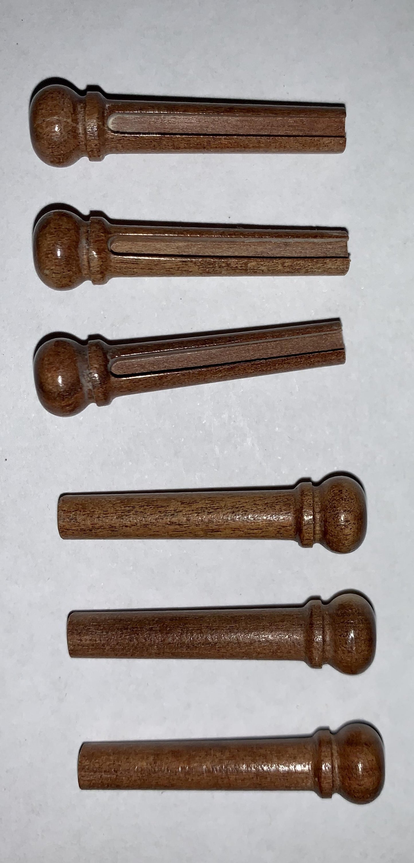 1 set (6pcs) Guitar bridge pins size 1 Mulga Tapered shaft string slot running the full length of shaft. Diameter at top of shaft 5.3mm (0.21") length of shaft 22.9mm (0.9") . Will fit the following models - Martin guitars prior to 1994 (except HD-28), Collings guitars, prior to 2002, Blanchard, Garrison, Goodall, Ryan, Santa Cruz, Taylor, Larrivee D-03R and others.