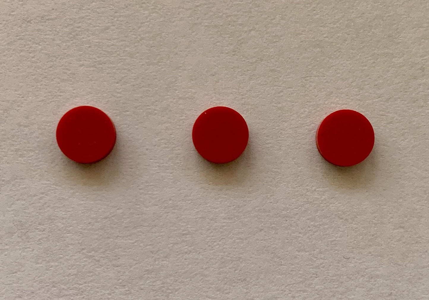 <p>Red stone ICOR14 dots 6mm diameter x 1.5mm thickness - round flat pcs cut to precise diameter and thickness. Ideal for use in inlay applications - for fretboard markers, and general inlay or jewellery decorations. All dots are A grade good on both sides.</p>