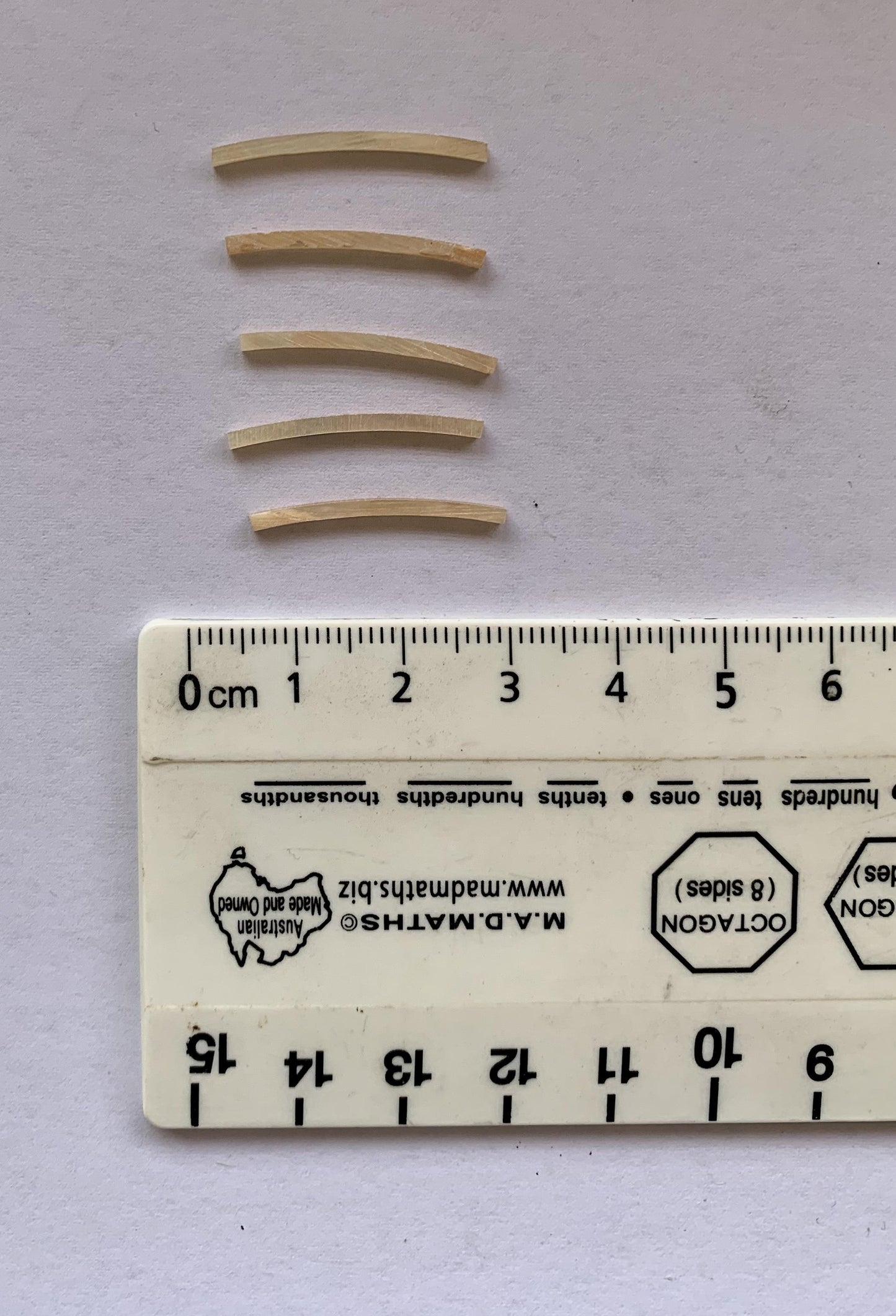 Awabi solid shell curved strips 1.3mm (0.05") width x 25mm (1") length x 1.3mm (0.05") thickness x 110mm (4.33") inside diameter. A grade quality good on both sides, flat and uniform in thickness and width. Ideal for use in purfling and rosettes on musical instruments - Ukuleles, guitars, mandolins etc. as well as in furniture, jewellery ans other decorative applications.