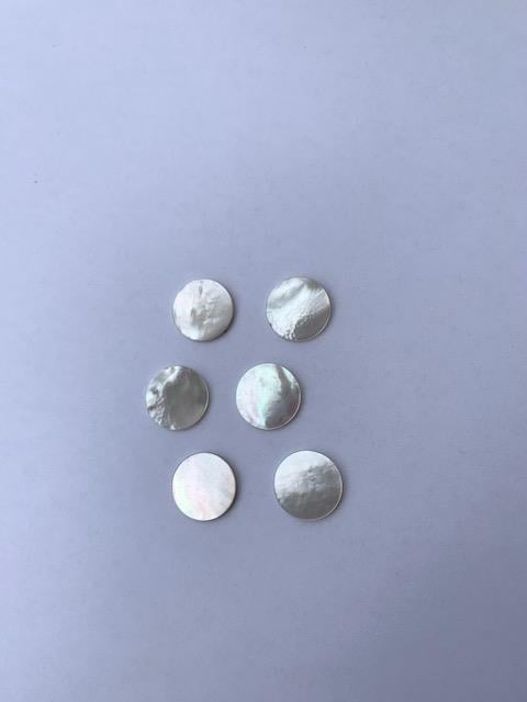 <p>White Mother of Pearl polished discs both sides 14mm (0.55") diameter x 1.3mm (0.05") thickness - round flat shell pcs cut to precise diameter and thickness. Ideal for inlay applications, watch dials and jewellery decorations. All discs are A grade good on both sides.</p>