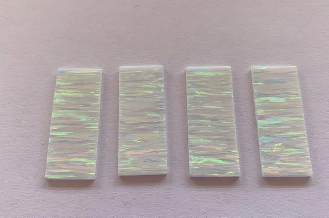 <p>Opal blanks OP17 17 x 42 x 1.5mm (0.67 x 1.97 x 0.06 flat cut pcs polished 1 side made from manufactured opal blocks suitable for inlay jewellery, bow slides. Opal blanks can be cut same way as mother of pearl blanks and are of similar hardness.</p>