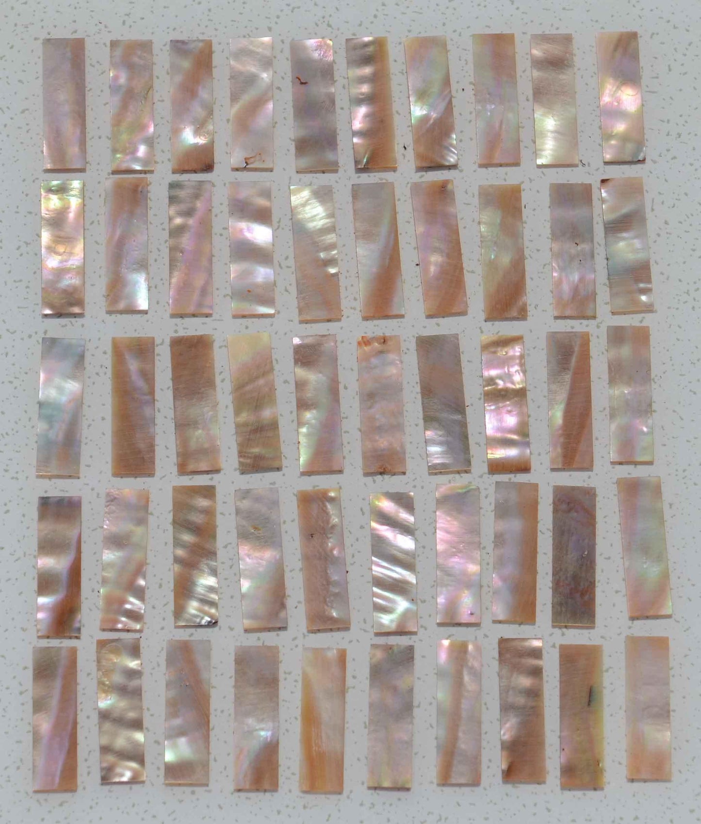 Awabi flat inlay blanks 9.5x43x1mm B grade - may contain shell skin or worm damage mostly on 1 side only also used as Awabi (Goldfish) bow slides B grade for violin and cello.