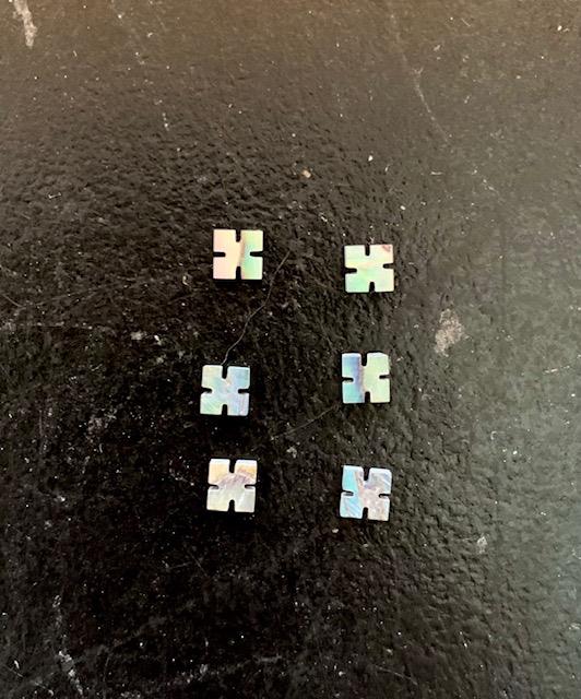 <p>Paua abalone (New Zealand Paua abalone) notched squares size 3.5mm (0.14") square x 1.5mm (0.06") thickness. Some uses include fretboard markers, musical instrument inlay, furniture inlay, marquetry, pool cue inlay and other general decorative inlay and jewellery applications. All pcs are A grade.</p>