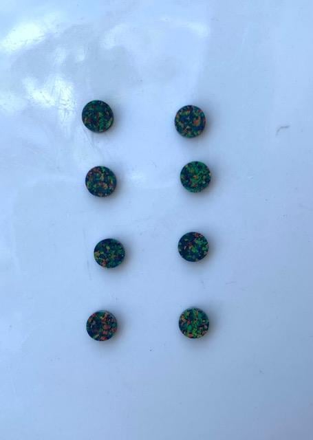 <p>Opal dots OP29 3 x 1.3mm flat pcs made to specific diameter and thickness made from manufactured opal suitable for inlay, fretboard markers, jewellery, Opal dots can be worked same way as mother of pearl and are of similar hardness.</p>