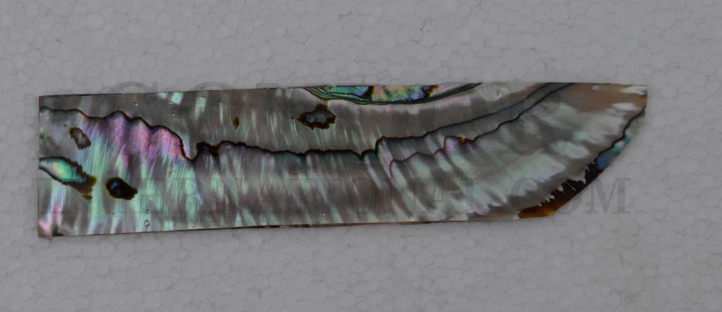 <p>Green abalone shell inlay feathers consist of single piece solid shell face layer 1.6mm thick laminated to shell laminate backing size 27 width x 80-85mm length x .1.6mm total thickness (including 1.1mm laminated sheet backing). Suitable for inlays, marquetry.</p>