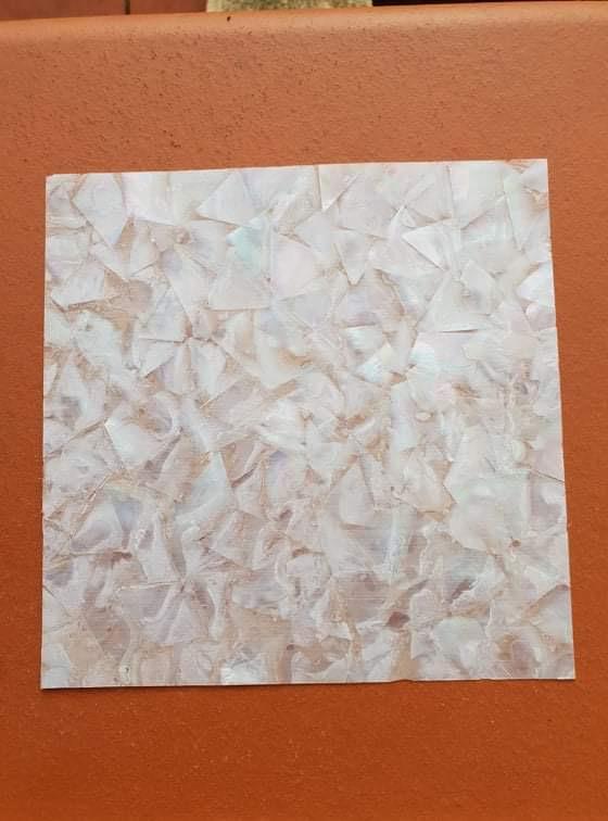 White MOP veneer also called White MOP sheet or White MOP shell paper. Made from thin slices of selected heart material from genuine shell. Sheet size 200mm (7.87") width x 200mm (7.87") length x 0.3mm (0.01") thickness Suitable for signwriting, fishing lures, jewellery, architectural application, furniture, surfboard decorations and many other applications.