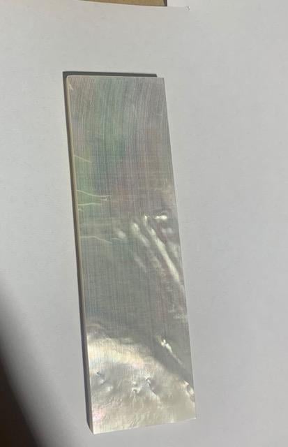 <p>White Mother of Pearl flat inlay blanks size 33mm (1.3") width x 80mm (3.15") length x 3.5mm (0.14") thickness A grade good on both sides.</p>