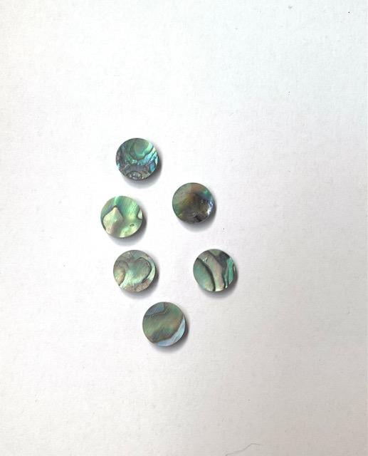 <p>Paua shell dots 10.15mm diameter x 2mm thickness are round flat shell pcs cut to precise diameter and thickness. Ideal for use in inlay applications - for fretboard markers and general inlay or jewellery decorations. All dots are A grade.<br /></p>