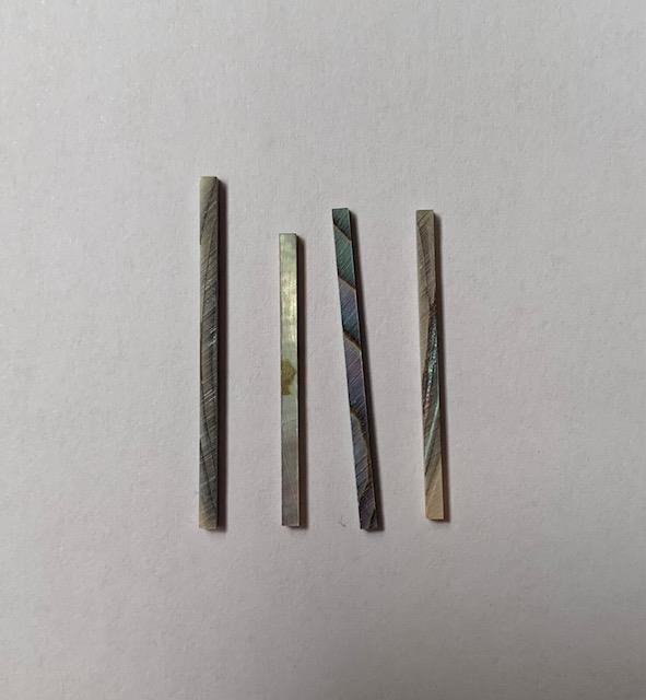 <p>Green abalone solid shell straight strips 1.5mm (0.06") width x random length x 1.5mm (0.06") thickness. A grade quality good on both sides, flat and uniform in thickness and width. Ideal for use in purfling on musical instruments - Ukuleles, guitars, mandolins etc. as well as in furniture, jewellery ans other decorative applications.</p>