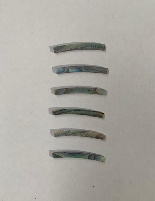 <p>Paua abalone laminated shell curved strips 2mm (0.08") width x 24mm (0.9") length x 1.5mm (0.06") thickness x 110mm (4.33") inside diameter. A grade quality flat and uniform in thickness and width. Ideal for use in purfling and rosettes on musical instruments - Ukuleles, guitars, mandolins etc. as well as in furniture, jewellery and other decorative applications.</p>