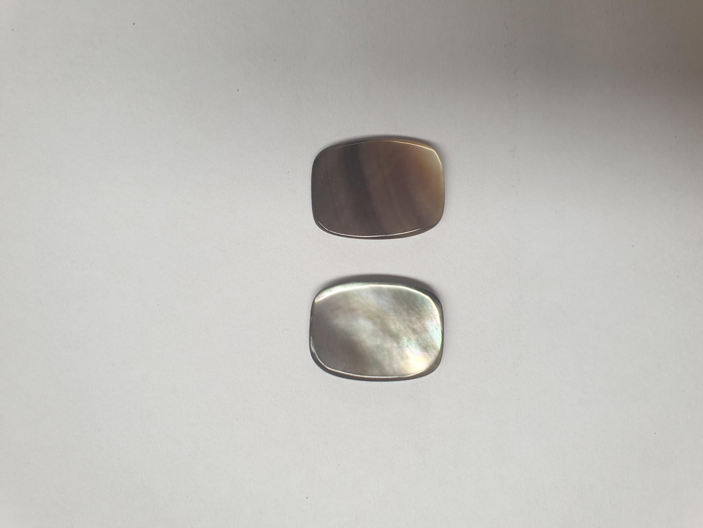 Black MOP cabochons rounded rectangle 15mm (0.59") width x 20mm (0.79") length x 2.3mm (0.09") thickness. Polished pcs with flat back and natural shell curve. Mainly used for jewellery but also suitable for inlay or other decorative purposes.