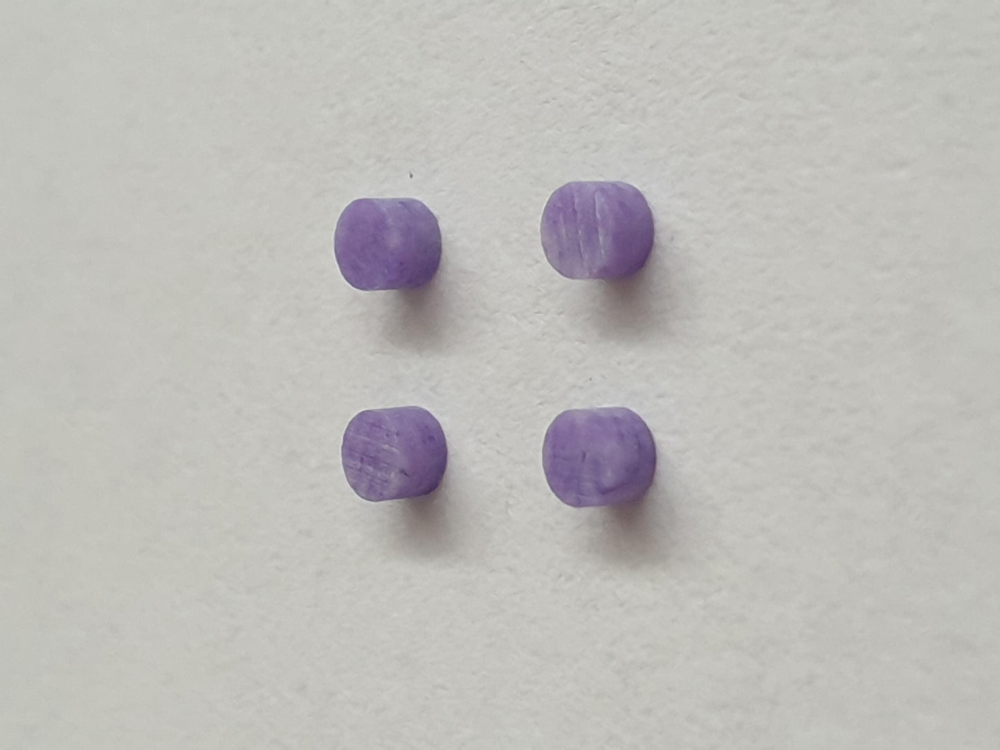 <p>Amethyst CHAR7 dots 2mm diameter x 1.3mm thickness - round flat pcs cut to precise diameter and thickness. Ideal for use in inlay applications - for fretboard markers, and general inlay or jewellery decorations. All dots are A grade good on both sides. Note if you would like a darker coloured purple stone you may like our SUGID Amethyst.</p>