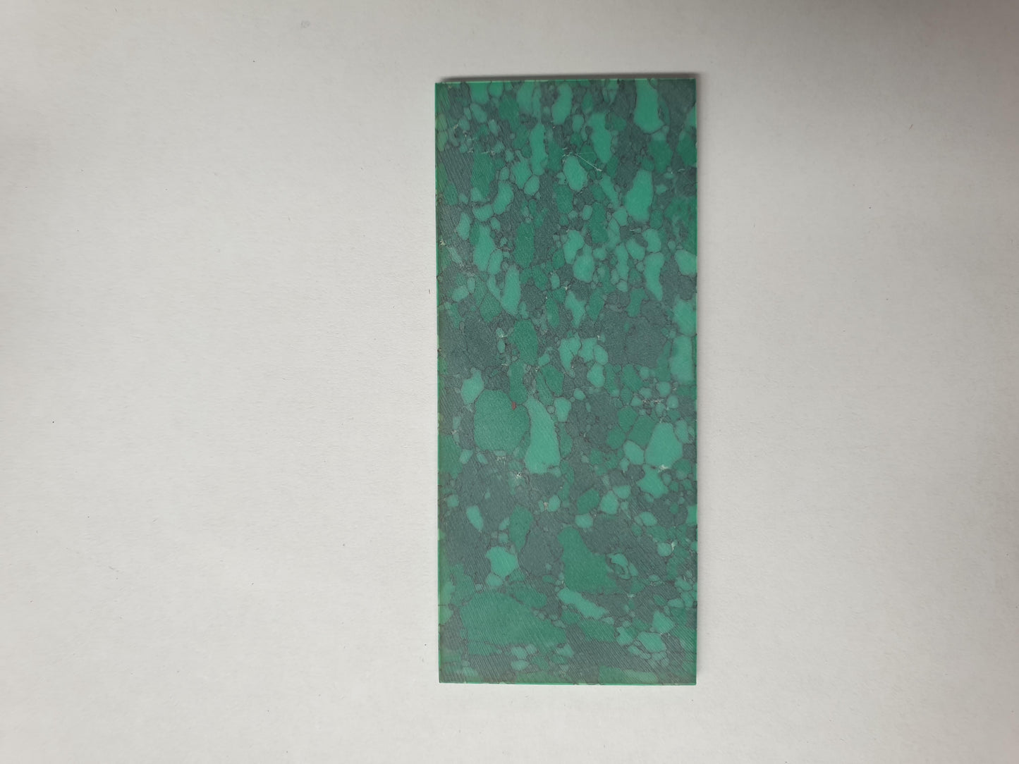 <p>Malachite H01 reconstituted stone blanks 30 x 70 x 1.5mm suitable for inlay. Can be cut with standard cutting tools - jewellery saw similar in characteristics to mother of pearl (hardness approx. 3. Can be sanded and polished same way as shell material. All pcs are A grade good on both sides.</p>