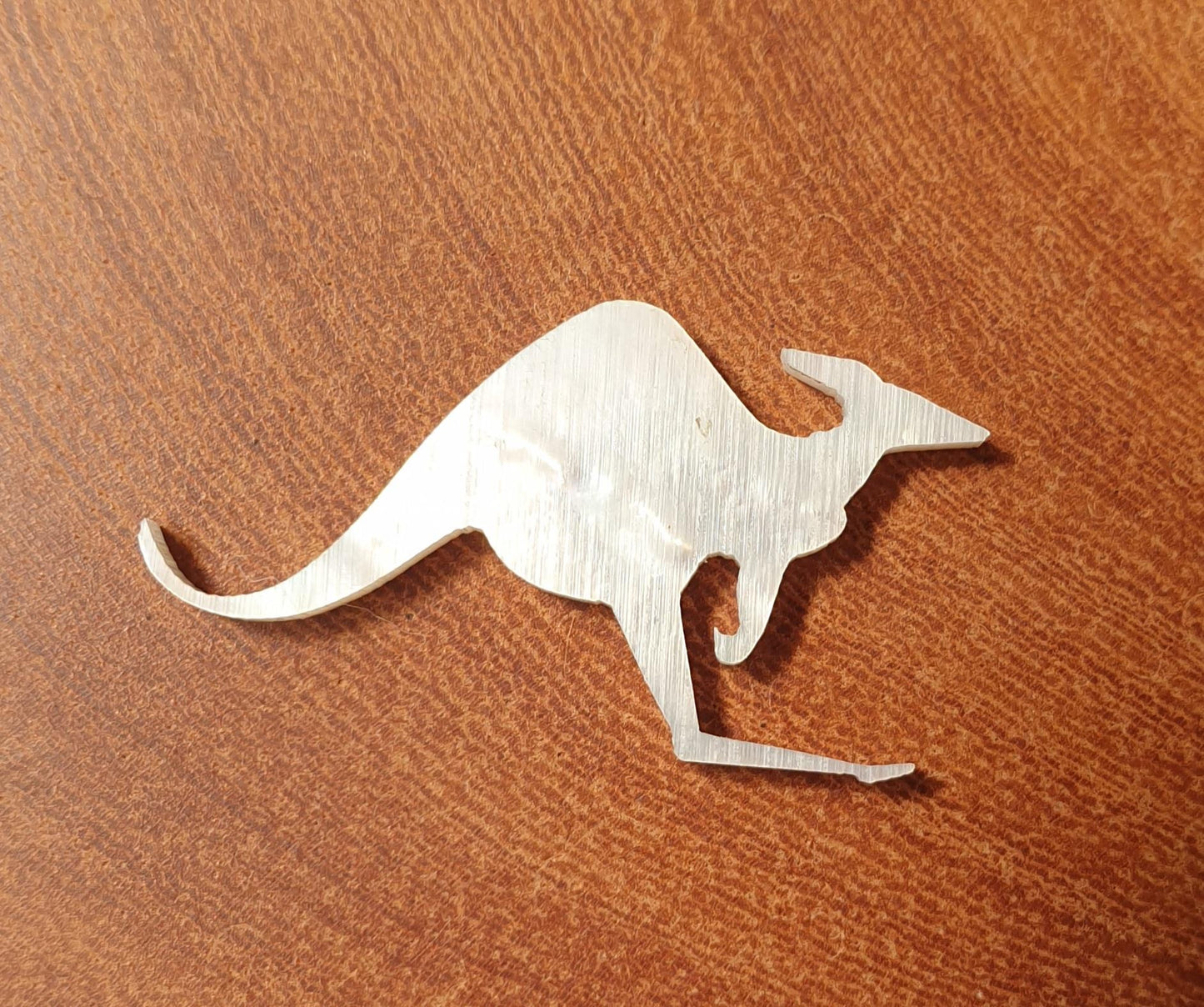 <p>White Mother of Pearl inlay Kangaroo size 13.3 x 25.3 x 1.5mm (0.06") thickness. Some uses include fretboard markers, musical instrument inlay, furniture inlay and other general decorative inlay and jewellery applications. All pcs are A grade.</p>