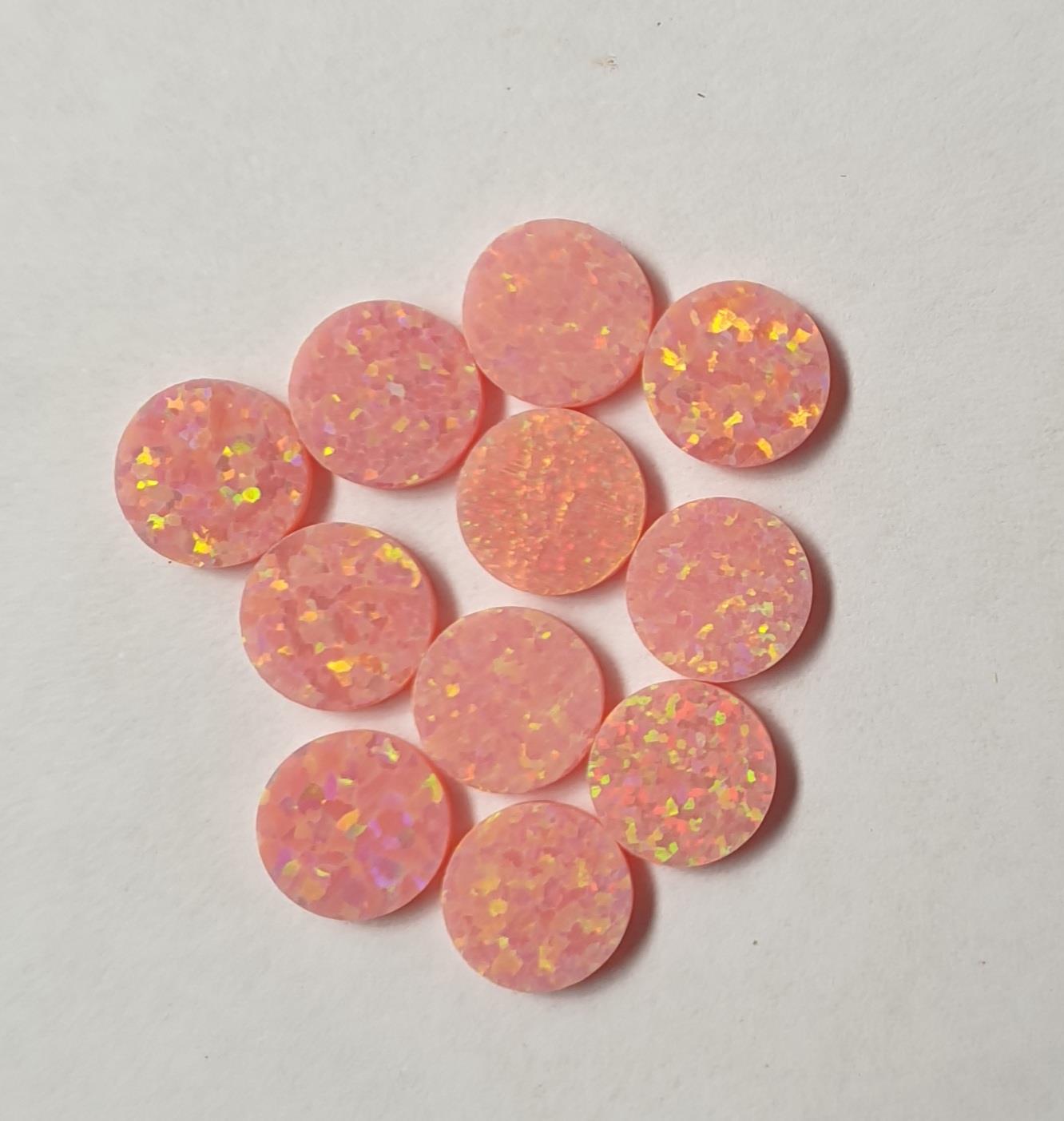 <p>Opal dots OP24 7 x 1.3mm flat pcs made to specific diameter and thickness made from manufactured opal suitable for inlay, fretboard markers, jewellery, Opal dots can be worked same way as mother of pearl and are of similar hardness.</p>