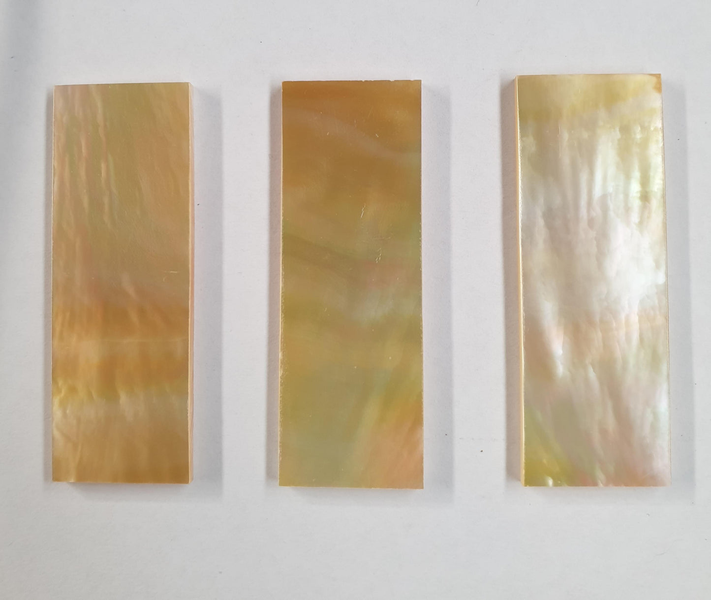 One piece Gold MOP flat inlay blanks size 22.5mm (0.886") width x 63.5mm (2.5") length x 2.5mm (0.1") thickness A grade. Polished 1 side.