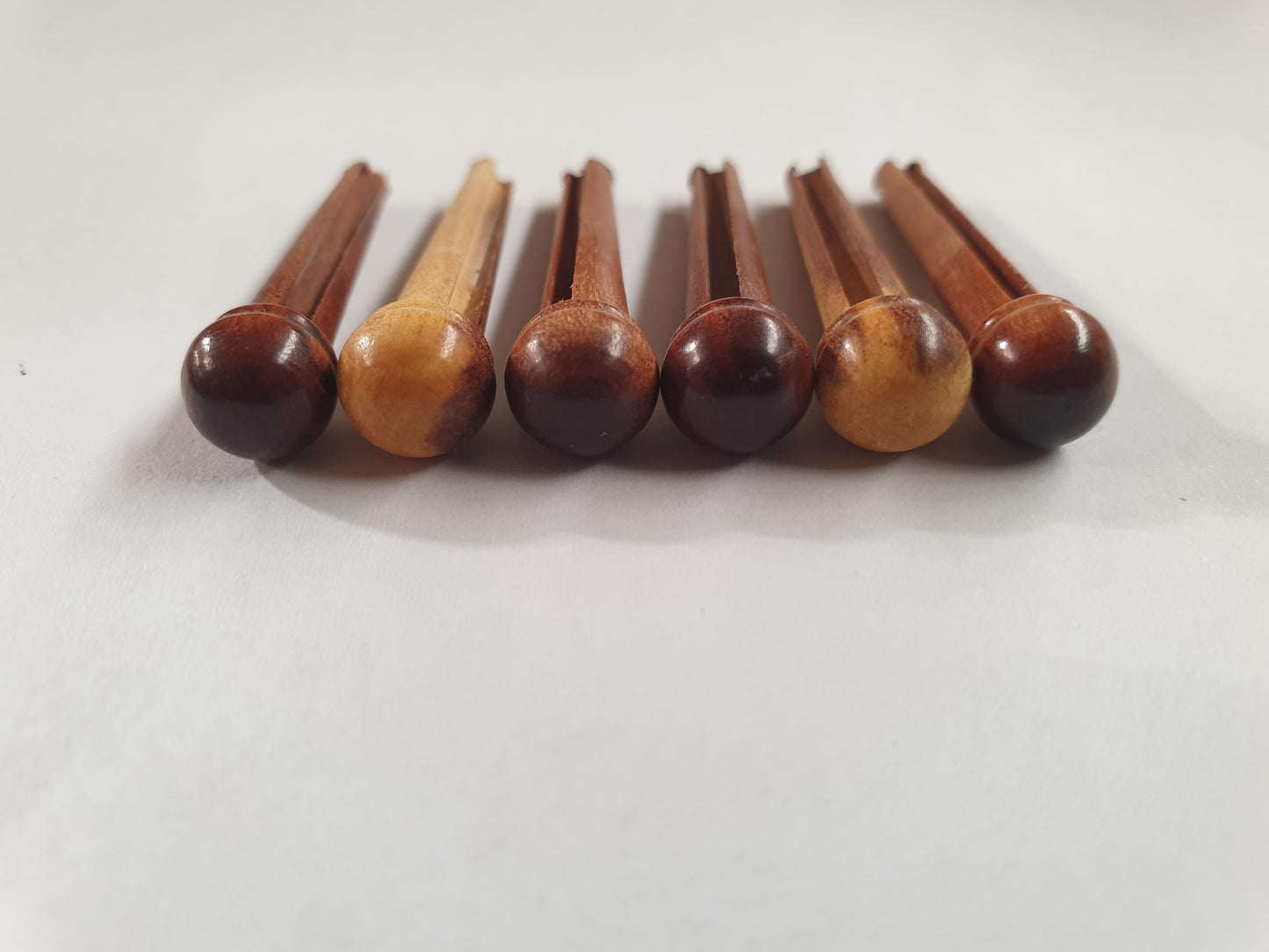 1 set (6pcs) Guitar bridge pins size 2A Mulga. Tapered shaft string slot running the full length of shaft. Diameter at top of shaft 5.6mm (0.22") length of shaft 25.5mm (1") . Will fit the following models - Martin guitars since 1994,as well as D-28 older Gibson guitars,and others.