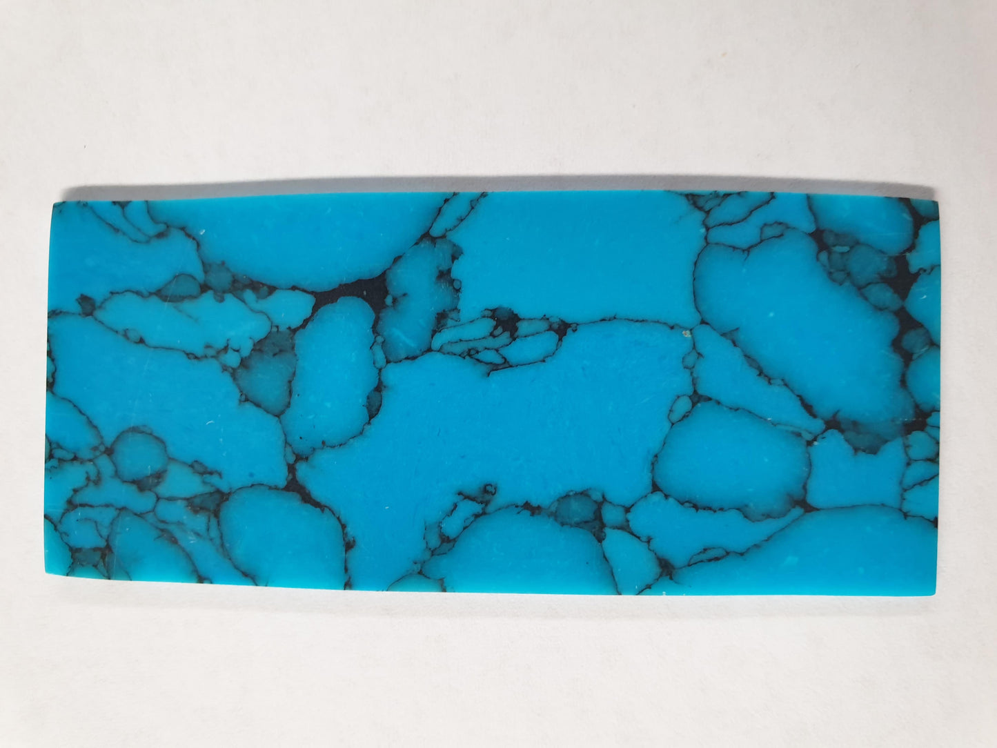 <p>Turquoise B14 artificial stone blanks 30 x 70 x 1.3mm polished 1 side suitable for inlay. Can be cut with standard cutting tools - jewellery saw similar in characteristics to mother of pearl (hardness approx. 3. Can be sanded and polished same way as shell material. All pcs are A grade good on both sides.</p>