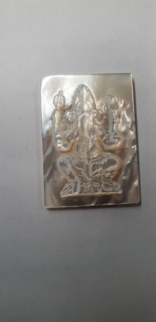 White MOP cabochon Ganesh 24.5mm width x 34.5mm length x 3.3mm thickness. Best grade W, MOP carving high quality precision work. Suitable for jewellery and other decorative applications. A grade.