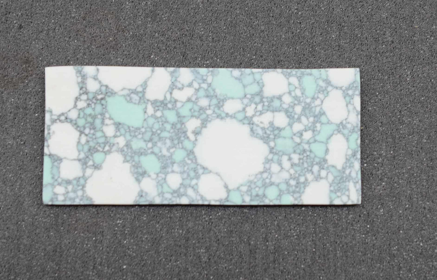 Marble Moravian CH2C6 artificial stone blanks 30 x 70 x 2.5mm suitable for inlay. Can be cut with standard cutting tools - jewellery saw similar in characteristics to mother of pearl (hardness approx. 3. Can be sanded and polished same way as shell material. All pcs are A grade good on both sides.